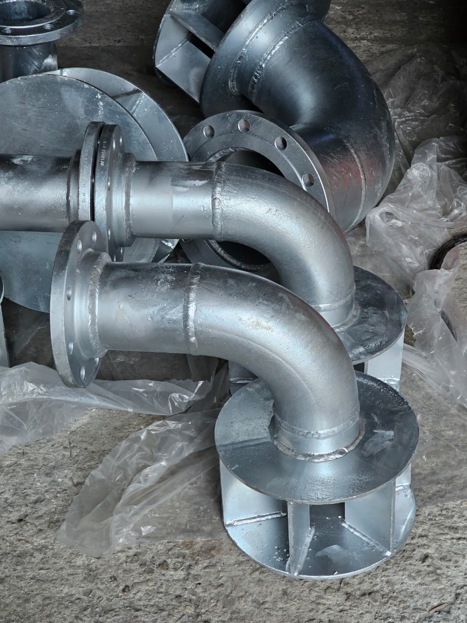 Galvanized elbow spool assemblies with flanged connections ready for delivery