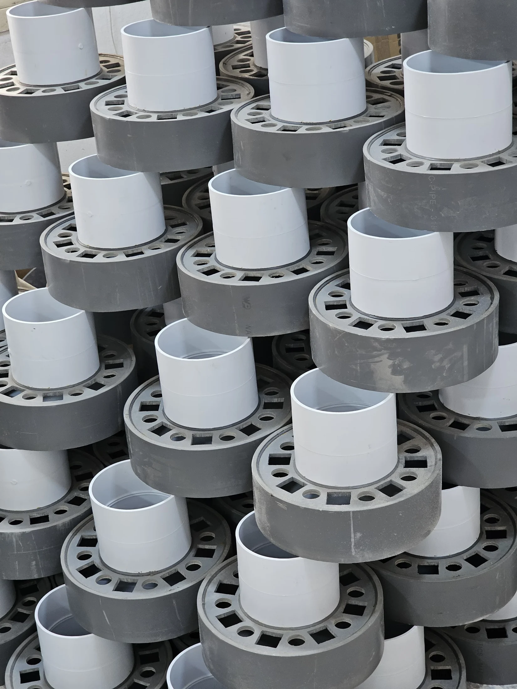 Batch of fabricated PVC flange assemblies at the AAMCO workshop